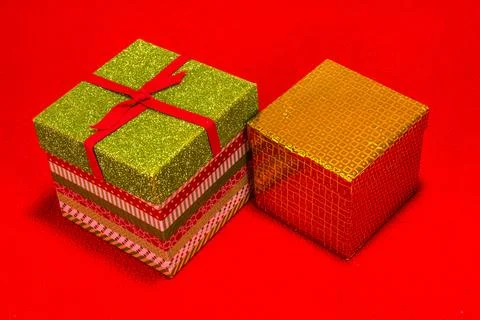 Two Christmas Gift Boxes On Red Background Stock Photos