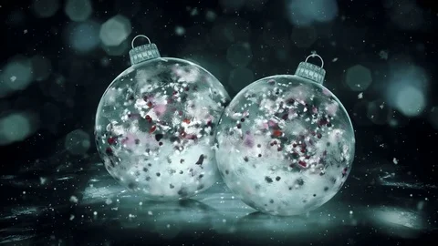 Two Christmas Grey Noir Ice Glass Baubles snow colorful petals background loop Stock Footage 82431158