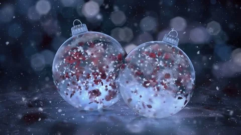 Two Christmas Rotating Blu Ice Glass Baubles snow red petals background loop Stock Footage 82670760