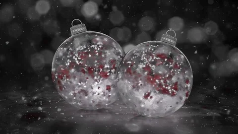 Two Christmas White Ice Baubles Decorations snow red petals background loop Stock Footage 82435074