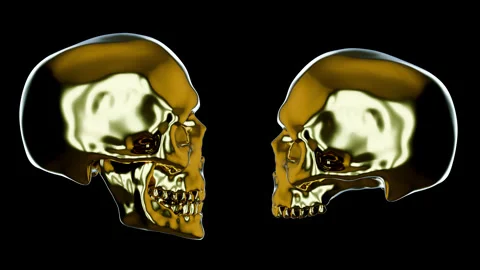 Two chrome golden skull isolated on black background. Stock Footage 288205568