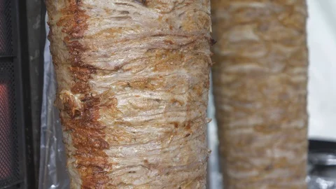 Two chunks of rolling kebab being grilled. Stock Footage 107958366