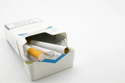 Two cigarettes and a hand-rolled cigarette Stock Photos