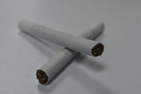 Two cigarettes stacked on top of each other Stock Photos
