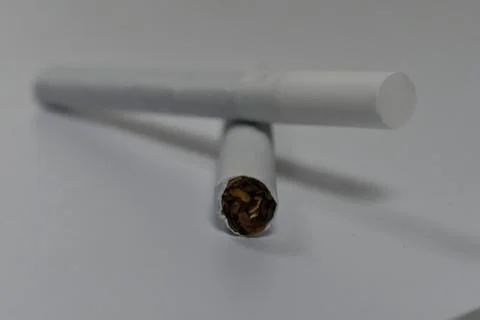 Two cigarettes stacked on top of each other Font view Stock Photos