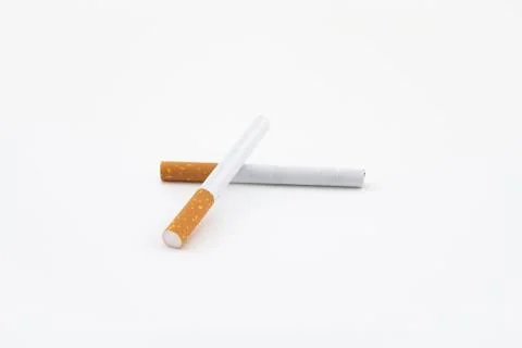 Two cigars isolated on white background. Filtered cigarettes. Stock Photos