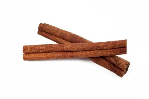 Two cinnamon sticks on a white background, isolate, close-up, top view. Foto stock