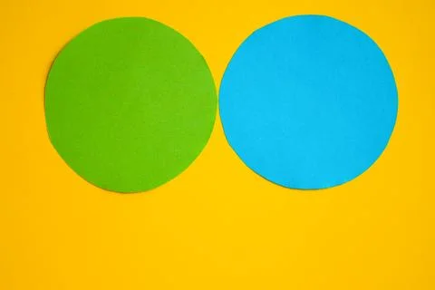 Two circles - green and blue on a yellow background. A space to create ideas. Stock Illustration