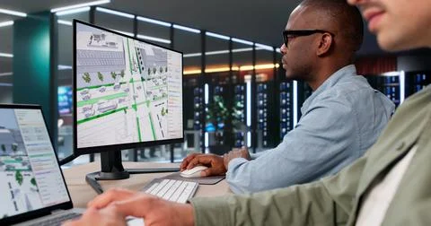 Two Civil Engineers Use 3D Software Analyzing Urban Traffic Flow Carefully. Stock Photos