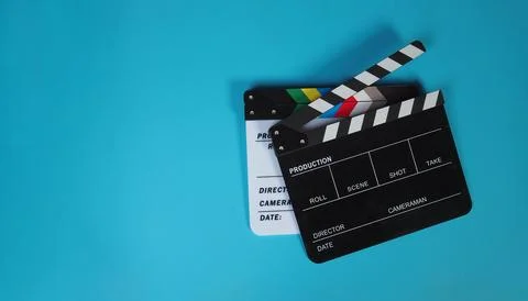 Two clapper board on blue or carpi color background. Stock Photos