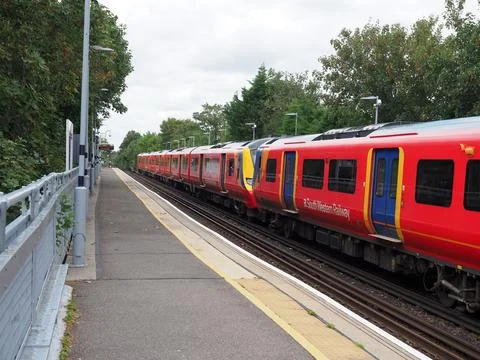 Two class 707 electric multiple units at Hampton Wick station in London in the Stock Photos