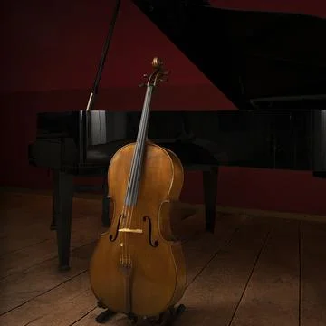 Two classical instruments - the cello and the grand piano - on a stage waitin Stock Photos
