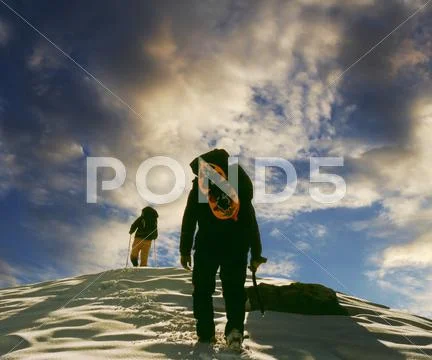Two climbers the climb on the peak Stock Photos