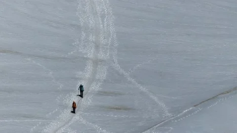 Two climbers cross the glacier Stock Footage 137395093