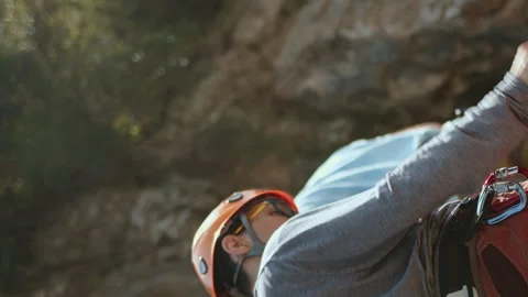 Two Climbers Preparing Gear for Rock Climb, Focused and Ready in Natural Setting Stock Footage 272625824