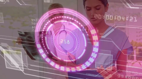 Two clinicians comparing chart and X-ray as HUD rotating and updating readouts, Stock Footage 333789850