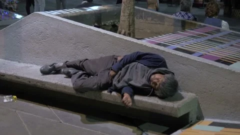Two Clips Of Homeless Mexican Man Sleeping In Plaza Garibaldi, Mexico City Stock Footage 154547457