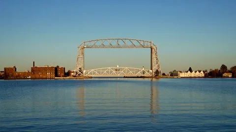 Two clips of the Iconic Duluth Minnesota Aerial Lift Bridge and Duluth Harbor Stock Footage 98380206