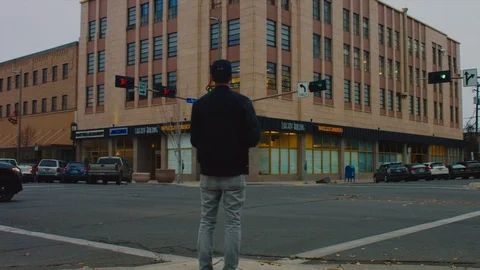 Two Clips, Man Standing on Street Corner 4K Stock Footage 102871473