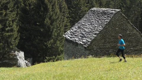 Two clips of running man in the meadow Vídeo Stock 114176123