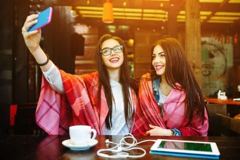 Two close friends make selfie in the cafe Stock Photos