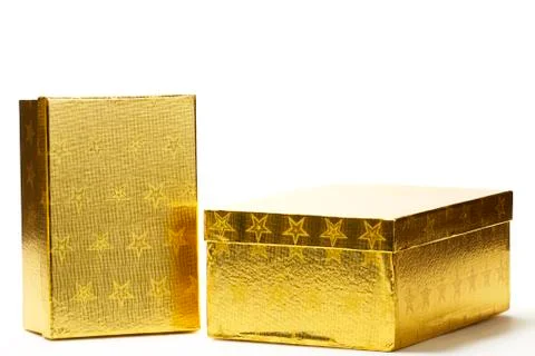 Two closed golden present boxes Stock Photos