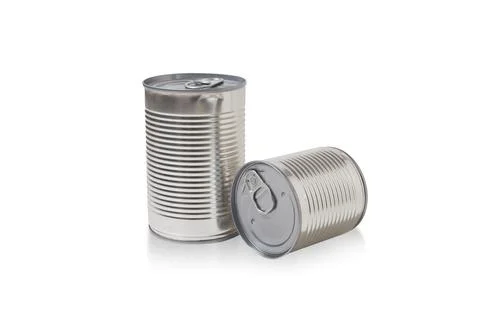 Two closed tin cans isolated on white background. Aluminum, canned food. Stock Photos