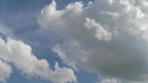 Two cloud layers moving at different heights in timelapse Stock Footage 343066998