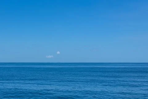 Two Clouds Over Two Islands At The Horizon Stock Photos