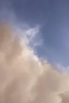Two clouds, warm and cold, meeting of cyclones in the sky, meeting of weather Stock Photos