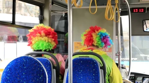Two clowns riding in a bus Stock Footage 84206843