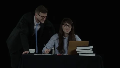 Two co-workers are pleased that the work turned out very well Stock Footage 77679806