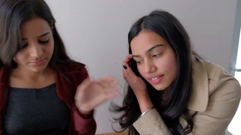 Two co workers in a studio talk and discuss stuff Stock Footage 101272865