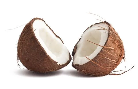 Two coconut halves on white Stock Photos