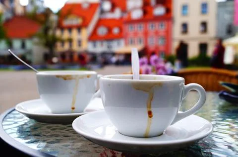 Two coffee cups against Riga old town view Stock Photos