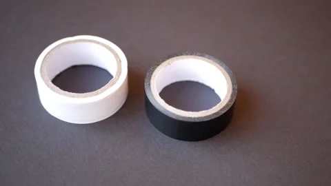 Two coils of electrical tape, black and white Stock-Footage 153287025