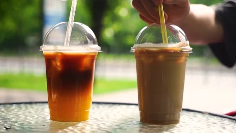 Two cold coffee drinks with ice. Terrace. Stock Footage 244783770