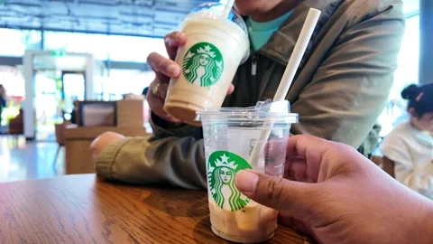 Two cold Starbucks beverages Stock Footage 328798331