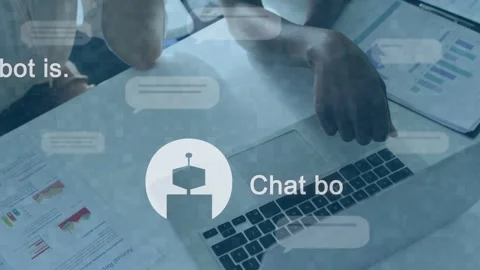 Two collaborators pointing at touchpad, initiating animated chat UI and forming Stock Footage 335316691