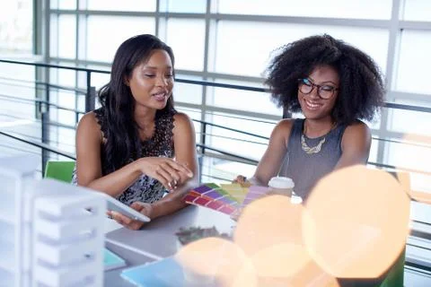 Two  colleages discussing ideas using a tablet computer Stock Photos