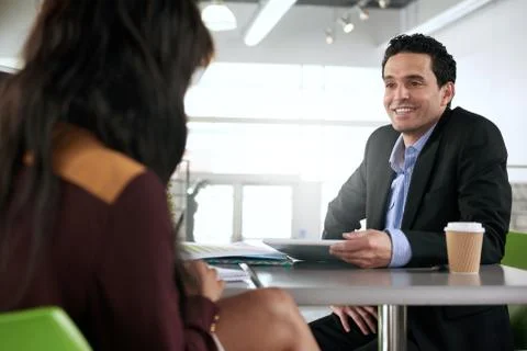 Two  colleages discussing ideas using a tablet Stock Photos