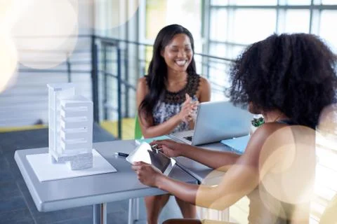 Two  colleages discussing ideas using a tablet computer Stock Photos