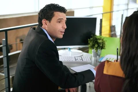 Two  colleages discussing ideas using a computer Stock Photos