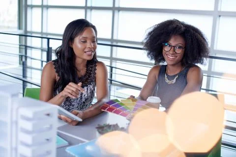 Two  colleages discussing ideas using a tablet computer Stock Photos