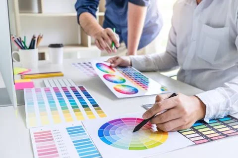 Two colleague creative graphic designer working on color selection and color Stock Photos