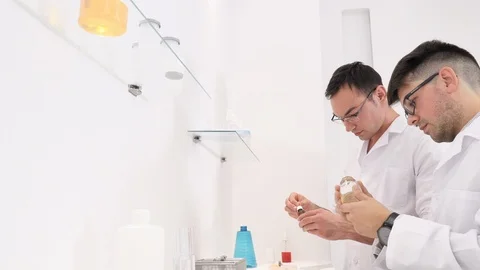 Two colleagues and pharmaceutical workers invent new drugs Stock Footage 118009502