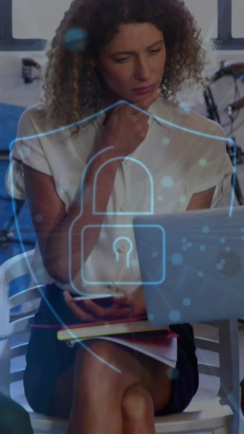Two colleagues are discussing over a laptop in the office Stock Footage 344745576