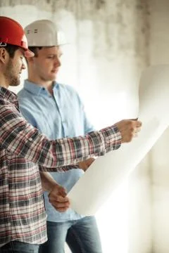 Two colleagues are solving problems at workplace Stock Photos