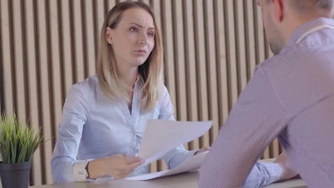 Two colleagues arguing and the man leaving Stock Footage 72984224