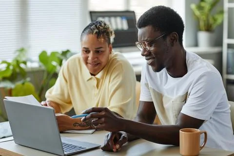Two Colleagues Collaborating On Project Stock Photos